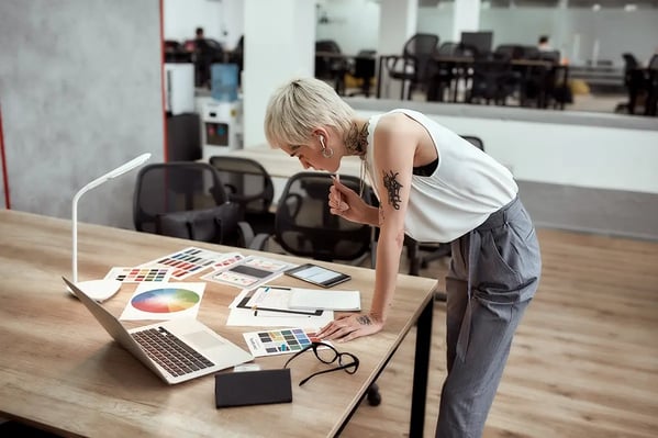 Designer looking at press proofs