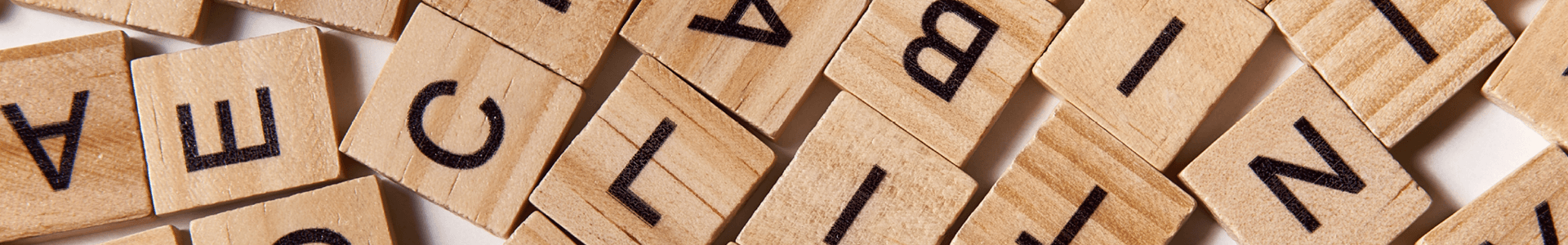 A pile of wooden blocks that each have a letter on them