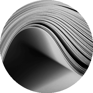 stack of paper bent into a curve